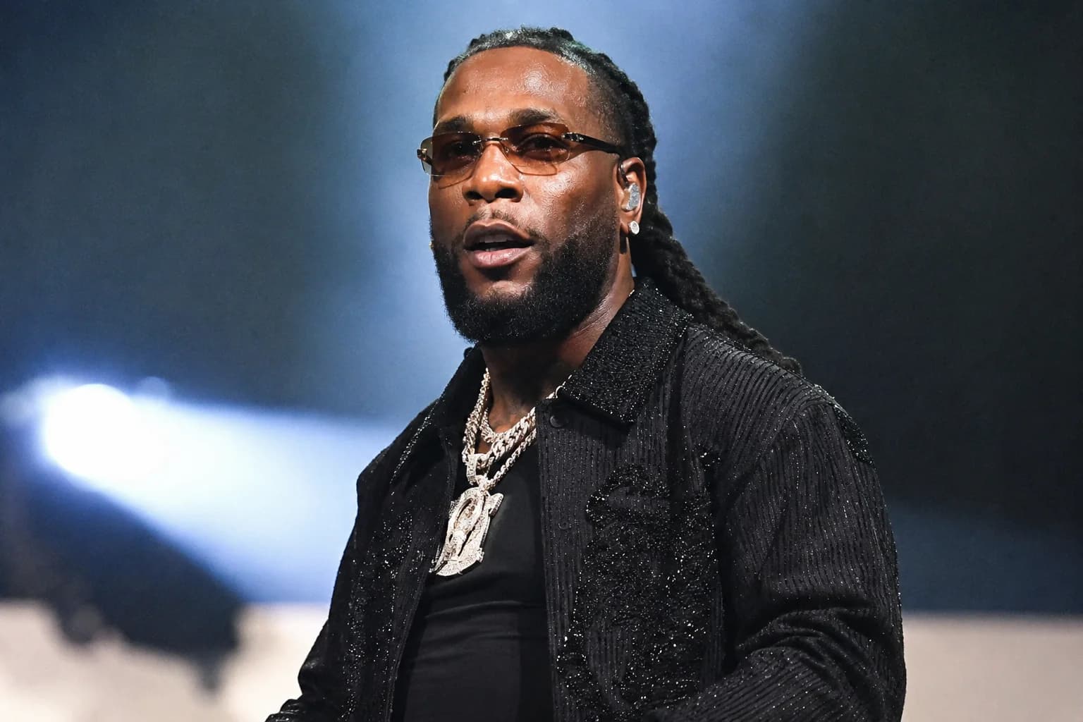 Nigerian music star Burna Boy performing on stage ahead of his appearance at the historic FIFA World Cup Final halftime show alongside global music icons.