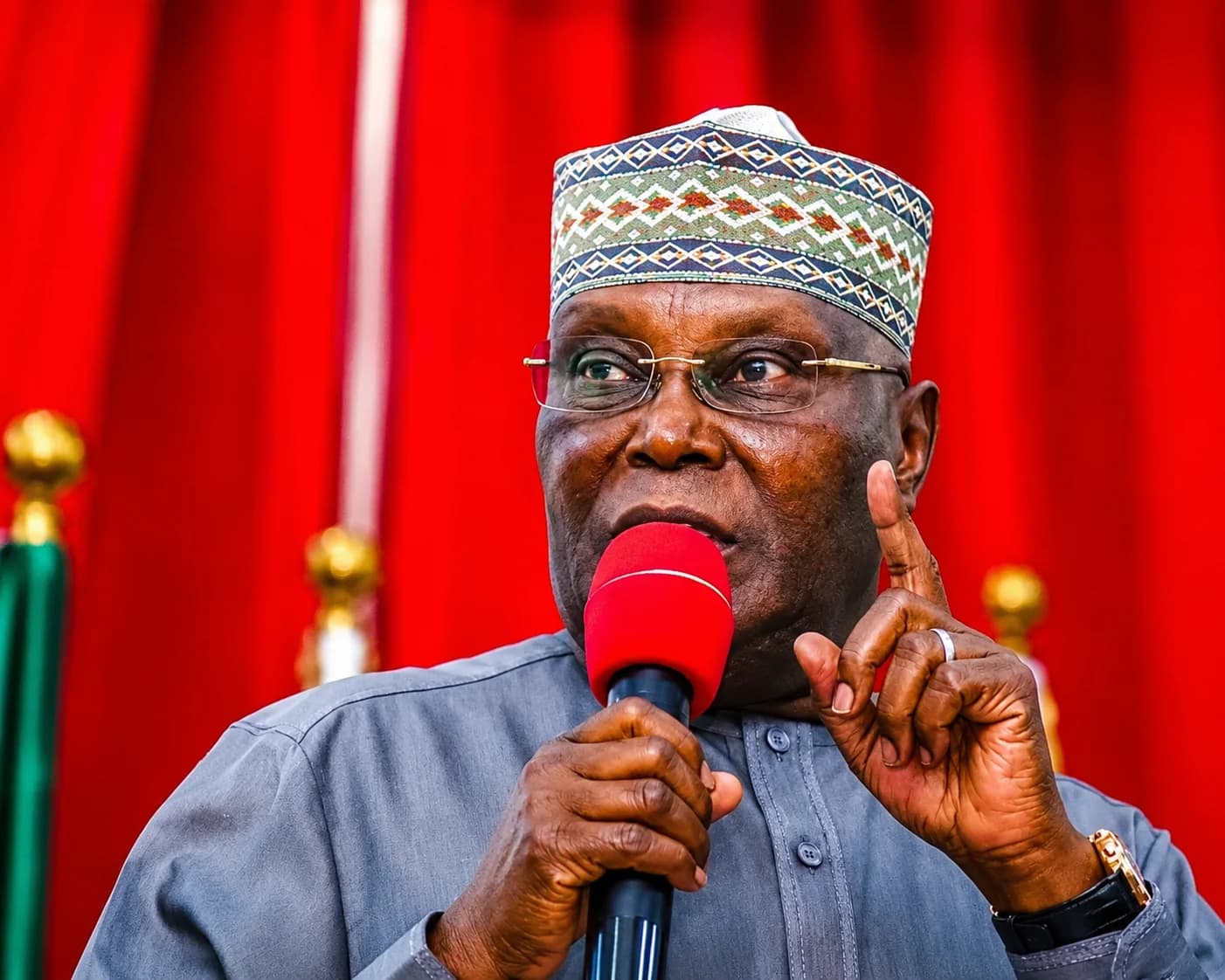 Former Vice President Atiku Abubakar speaking at a political event while criticising the Federal Government's economic policies.