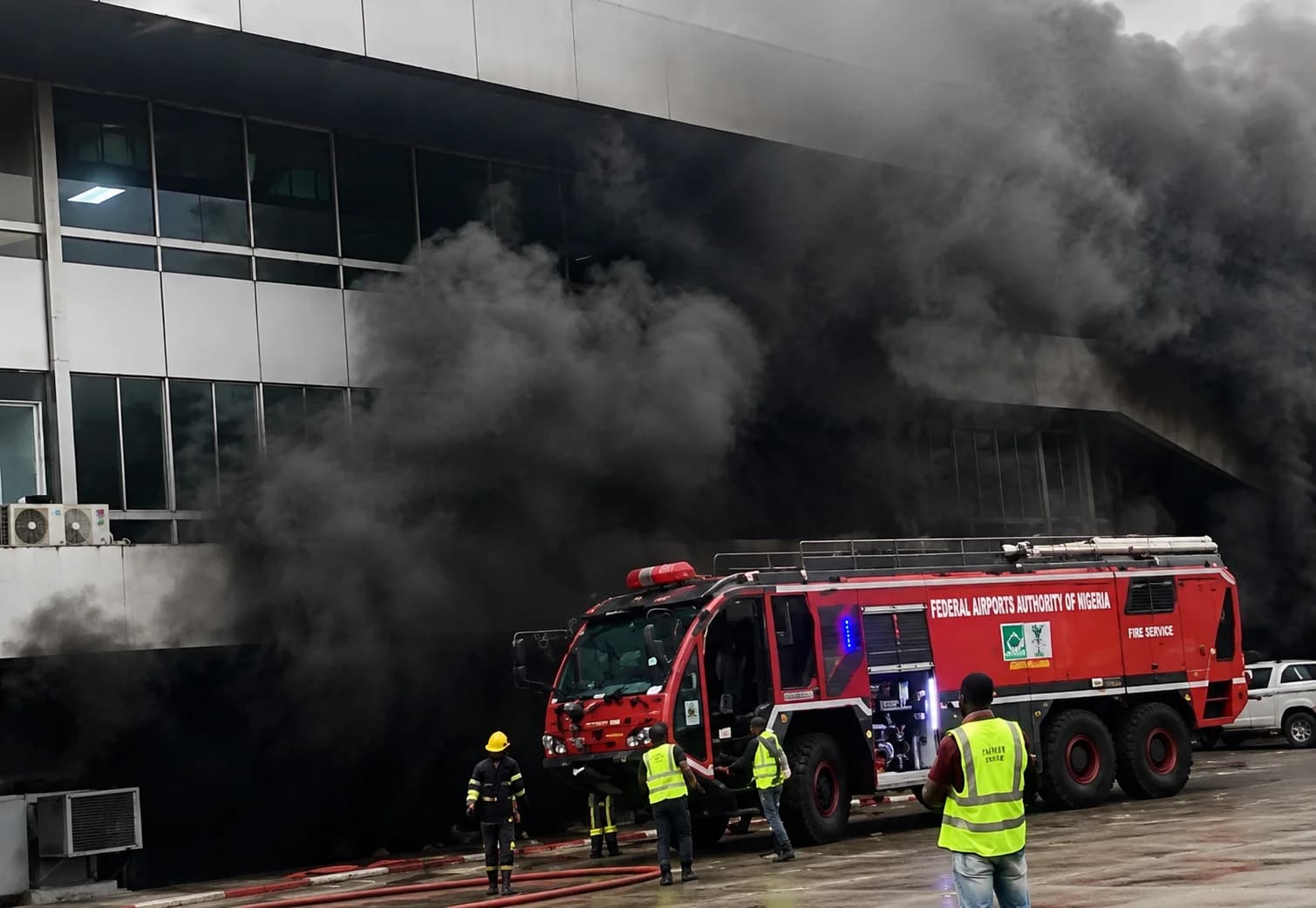 Emergency responders battling a fire at Terminal 1 of Murtala Muhammed International Airport in Lagos while firefighters secure the area.